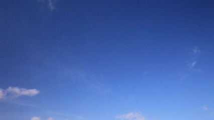 Wall Mural - blue sky on a sunny day. on a clear sky, light cumulus clouds appear and disappear. beautiful skysca