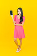 © siraphol - Portrait beautiful young asian woman smile with smart mobile phone