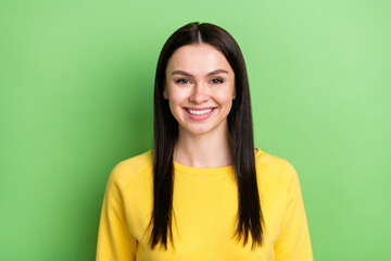 Photo portrait of pretty brunette smiling in yellow outfit isolated on bright green color background