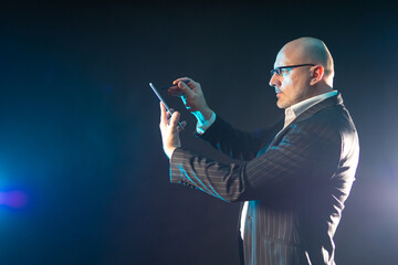 Poster - human in a suit with a phone. a man dressed in a business style.