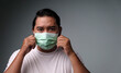 © 2D_Jungle - Asian man in white shirt wearing a protective mask to prevent covid-19 virus