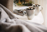 Fototapeta Łazienka - Silver mugs and fluffy, warm blanket