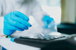 © Charnchai saeheng - Scientists use Cotton Bat for keep and checking and testing virus on labtop at home.