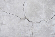 Crack Wall Texture. Cracked Concrete Wall Covered With Cement Surface As Background. Wall Fragment With Scratches And Cracks