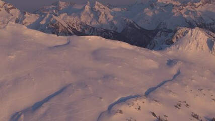 Wall Mural - 4k aerial dramatic mountains winter sunset
