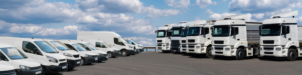 Poster - Semi trucks and delivery vans are parked in rows. Commercial fleet