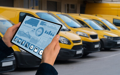 Poster - Manager with a digital tablet on the background of vans. Fleet management	