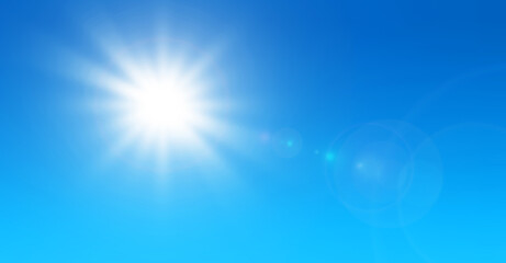 Wall Mural - sun with lens flare and blue sky background