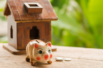 Ceramic piggy bank on the wooden floor