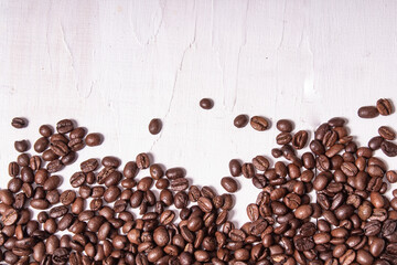 Poster - Top view of roasted coffee beans on a wooden table