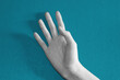 black and white hand on blue background