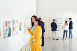 Fototapeta  - People at exhibition in modern art gallery