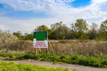Large Sign Advertising Commercial Land For Sale. No People. Copy Space.