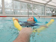© OLEKSANDR - boy in the pool learns to swim