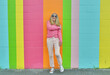 Senior Woman Portrait on Bright Color Wall 
