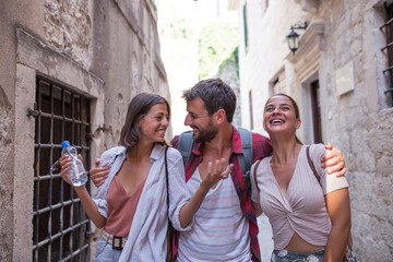 Wall Mural - Group of young travelers in a city