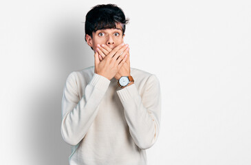 Wall Mural - Handsome hipster young man wearing casual winter sweater shocked covering mouth with hands for mistake. secret concept.