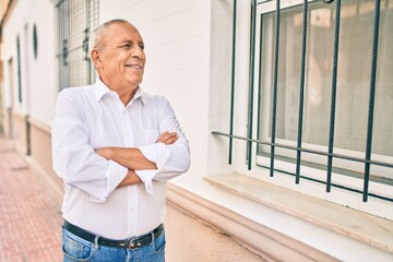 Wall Mural - senior man smiling happy walking at the city.