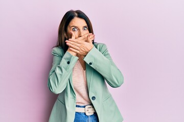 Sticker - Middle age brunette woman wearing casual clothes shocked covering mouth with hands for mistake. secret concept.