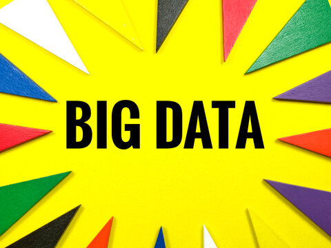 Digital concept.Colorful pieces of wood on yellow background with text BIG DATA.
