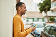© Krakenimages.com - Young african american man smiling happy using smartphone at the city.