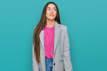 Poster - Young hispanic girl wearing business clothes smiling looking to the side and staring away thinking.