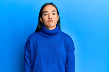 Sticker - Young asian woman wearing casual winter sweater looking sleepy and tired, exhausted for fatigue and hangover, lazy eyes in the morning.