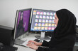 © .shock - Young muslim girl working on the computer from home