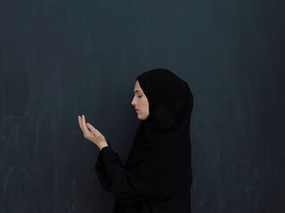 Wall Mural - Portrait of young Muslim woman making dua