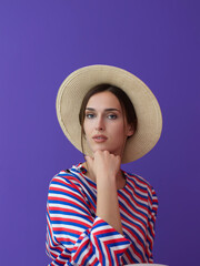 Wall Mural - Portrait of young woman sitting on the chair