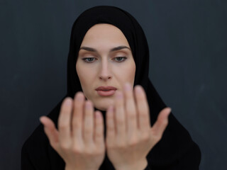 Wall Mural - Portrait of young Muslim woman making dua