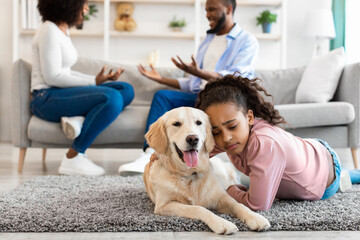 Poster - Sad black girl embracing dog, parents fighting in the background