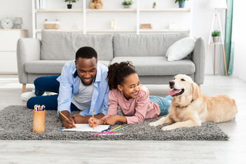 Wall Mural - Happy black family drawing with dog at home