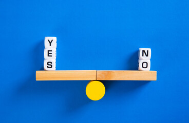 Yes vs No. Choice concept. Balance scales on blue background.