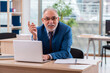 © Elnur - Old male boss employee working in the office