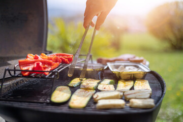 Wall Mural - Vegetarian BBQ on weekend. Grill cheese and vegetables on gas grill. Outdoors.