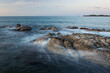 Waves and rocks shore long exposure