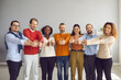 © Studio Romantic - Group of interracial people showing raised thumbs on camera as a gesture of recommendation or a good choice. Multicultural team demonstrates satisfaction and gives a positive response.