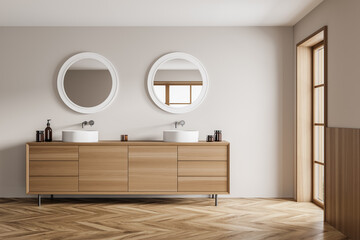 Light bathroom interior with two sinks with window, wooden floor