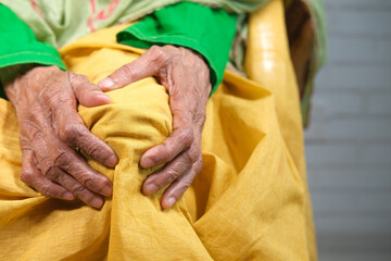 Wall Mural - Close up on senior women suffering knee joint pain