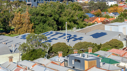 Wall Mural - Solar panels on small industrial buildings in Melbourne, Australia