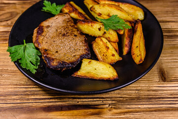 Roasted beefsteak with the fried potato and parsley