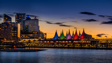 Blue Hour After The Sun Has Set Over The Harbor And The Colorful Sails Of Canada Place, The Cruise Ship Terminal And Convention Center On The Waterfront Of Vancouver, British Columbia, Canada