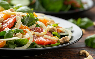 Wall Mural - Fresh salad with fennel, orange, grapefruit, spinach and cashew nuts. healthy food.
