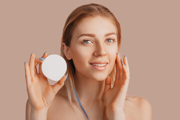 Wall Mural - girl make face beauty masks. anti-wrinkle cream for the freshness of the skin around the eyes. woman