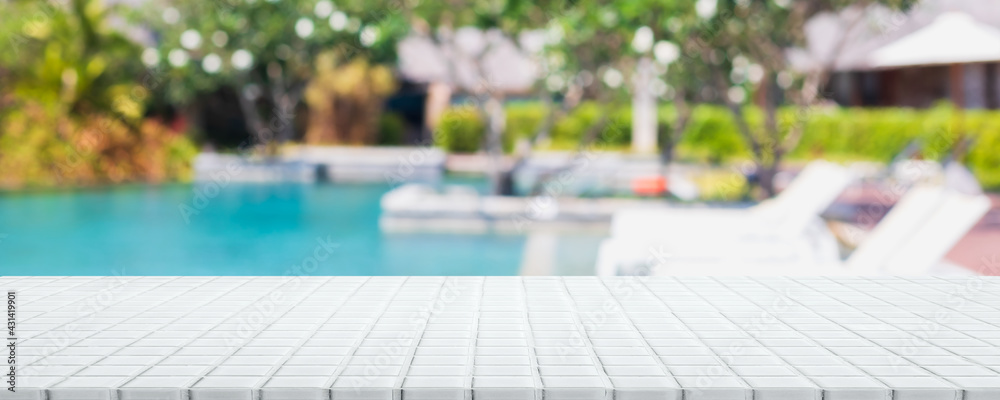 Empty white ceramic mosaic table top and blurred swimming pool in tropical resort in summer banner background - can used for display or montage your products. - obrazy, fototapety, plakaty 