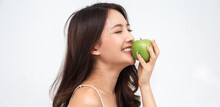 Smiling Of Cheerful Beauty Pretty Asian Woman Holding And Eating Fresh Green Apple On White Background.dieting Concept.healthy Lifestyle