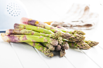 Wall Mural - Fresh raw uncooked green asparagus.