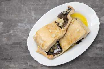 Sticker - boiled cod fish with olive oil on white dish