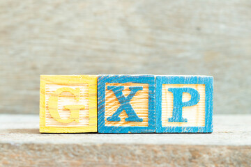 Canvas Print - Color alphabet letter block in word GXP on wood background